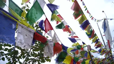 Colorful Buddhist Prayer Flags Waving in the Mountains Stock Footage 316892287