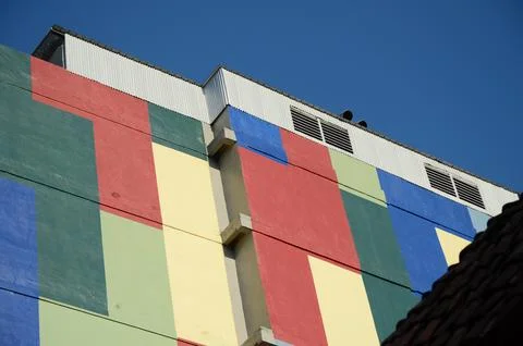 Colorful Building Facade with Geometric Patterns Stock Photos