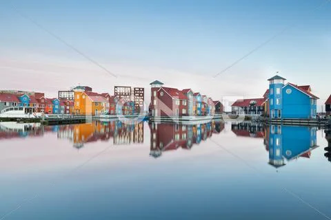 Colorful buildings on water at haven Stock Photos