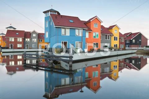 Colorful buildings on water Stock Photos