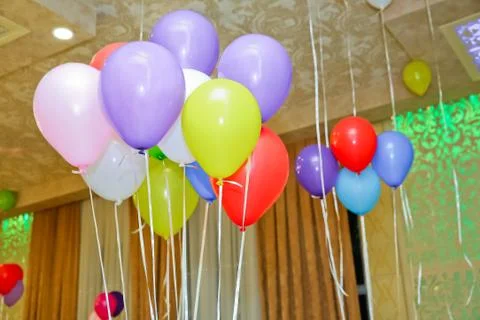 Colorful bunch of Easter egg balloons on bright white background. Minimal cre Stock Photos