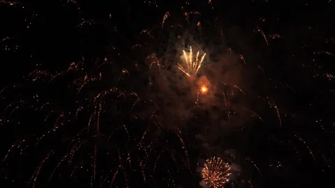 Colorful burning traces of firework bursts against darkness on holiday event Stock Footage 256065138