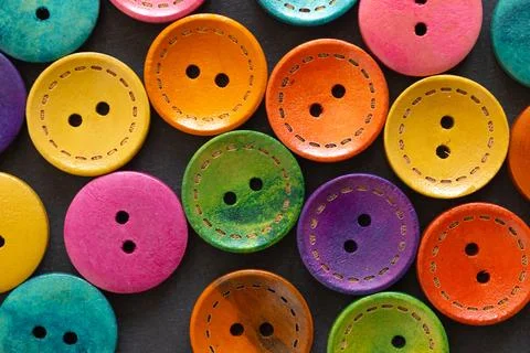 Colorful button on black background Stock Photos