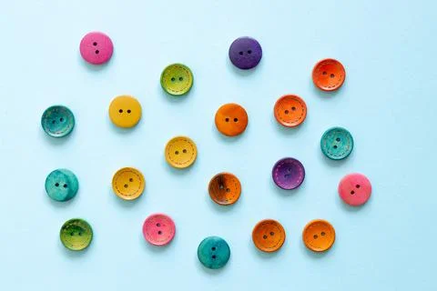 Colorful button on blue background Stock Photos
