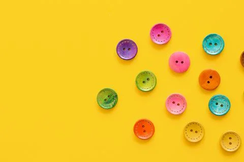 Colorful button on yellow background Stock Photos