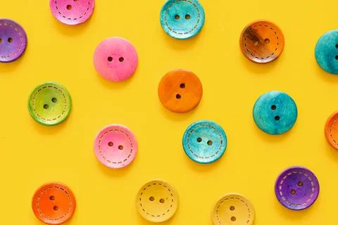 Colorful button on yellow background Stock Photos