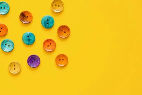 Colorful button on yellow background Stock Photos