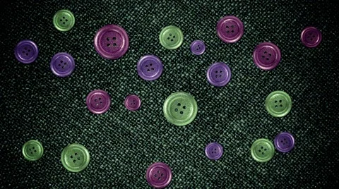 Colorful Buttons Moving on a Cloth in Stop Motion Style in Seamless Loop Stock Footage 66415276