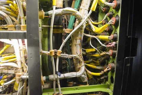 Colorful cables connected to server at data center. Colored cables intertwined w Foto stock