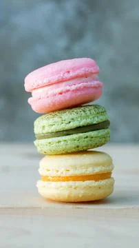 Colorful cake macaron or macaroon on wooden background. Stock Photos