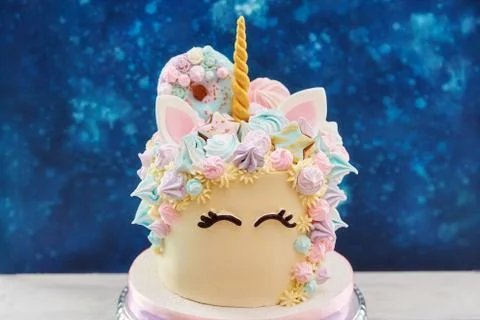 Colorful cake in shape of unicorn face Stock Photos