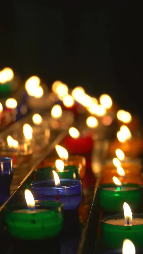 Colorful candles burning on the dark. Side View	 Stock Footage 280269402