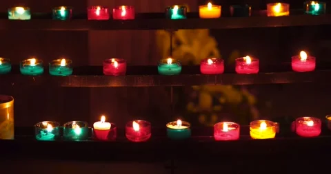 Colorful candles in the darkness. Stock Footage 140980845