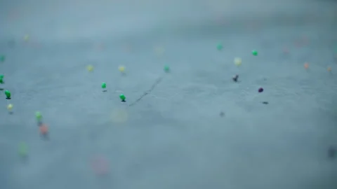 Colorful candy bouncing across a concrete floor in slow-motion. 動画素材 265636364