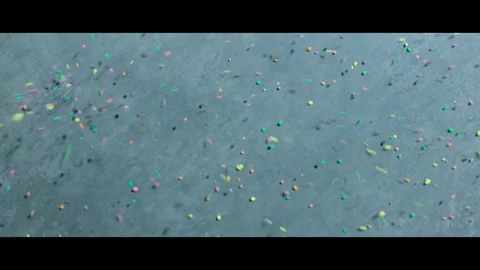 Colorful candy falling and scattering on a concrete floor. Stock Footage 265742612