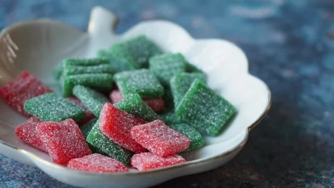 Colorful candy on a plate in bright kitchen setting Stock Footage 339827151