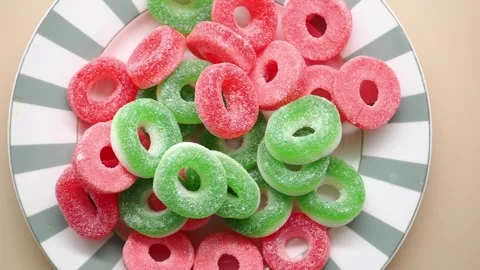 Colorful candy rings on a plate in a kitchen Stock Footage 335349530