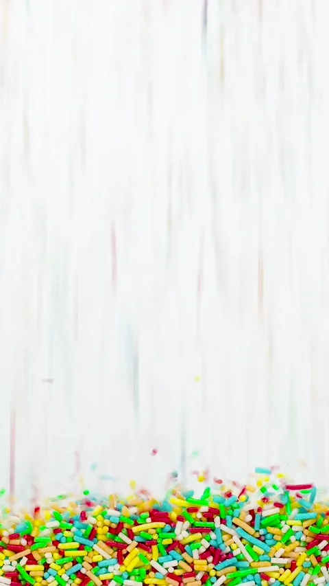 Colorful candy sprinkles falling down smoothly Stock Footage 322145442