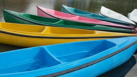 Colorful canoes floating Stock Footage 262958272