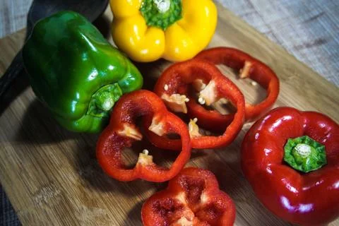 Colorful capsicum on wooden table background.Image with selective focus. Stock Photos