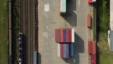 Colorful cargo, container train for freight transport in the railway station Stock Footage 346732442