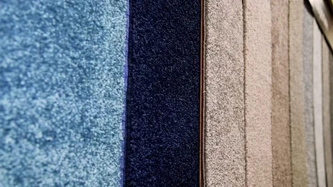 Colorful carpet samples are displayed on the store shelf. Stock Footage 205062729