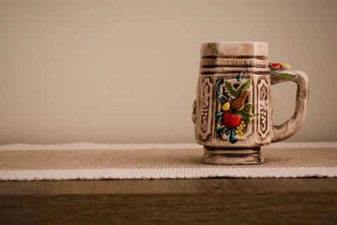 A colorful ceramic empty mug for coffee or tea. Home interior. Stock Photos