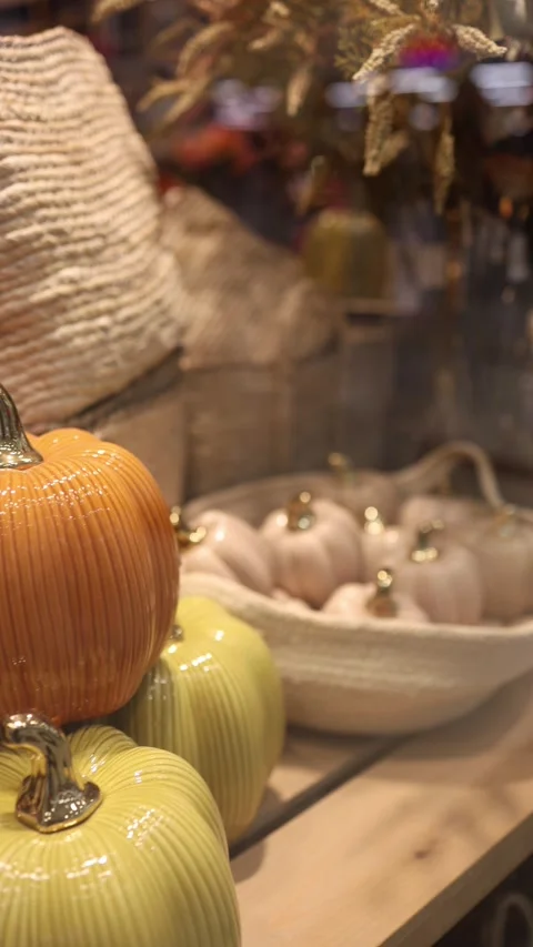 Colorful ceramic pumpkins displayed as elegant Halloween party decorations with  Stock-Footage 346973814