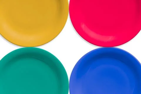 Colorful ceramic round plate. Isolated white background Stock Photos