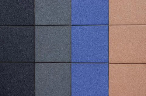 Colorful ceramic square tile pattern in black, gray, blue and beige tones Stock Photos