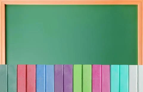 Colorful chalk over school blackboard Stock Photos