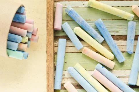 Colorful chalks on table Photos