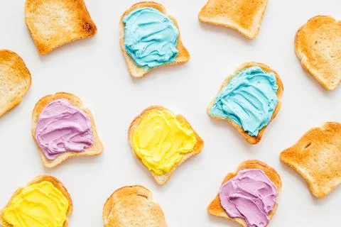 Colorful cheese spread on bread pattern, top view Foto stock