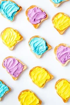Colorful cheese spread on bread pattern, top view Stock Photos
