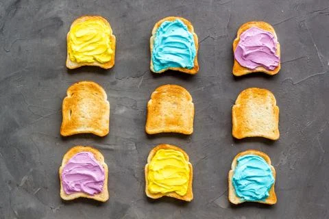 Colorful cheese spread on bread pattern, top view Stock Photos