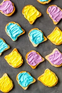 Colorful cheese spread on bread pattern, top view Foto stock