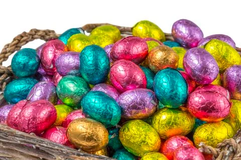 Colorful chocolate easter eggs in a basket Stock Photos