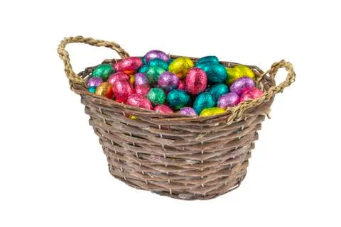 Colorful chocolate easter eggs in a basket Stock Photos