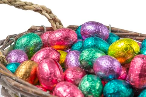Colorful chocolate easter eggs in a basket Stock Photos