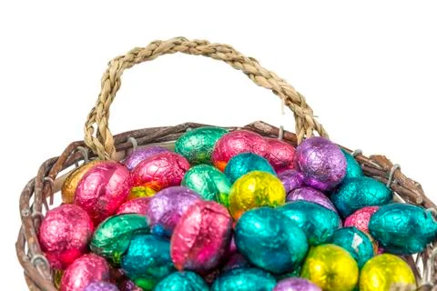 Colorful chocolate easter eggs in a basket Stock Photos