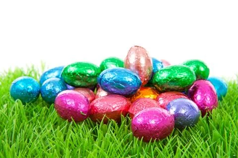 Colorful chocolate easter eggs on grass Stock Photos
