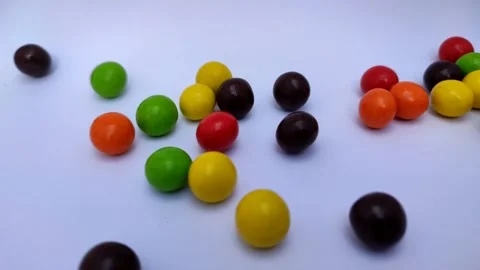 Colorful chocolate snacks in the shape of marbles with bread inside, 4k video Stock Footage 158995017