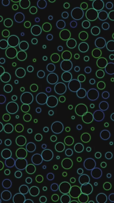 Colorful circles move and create patterns on a dark background in a fun visual Stock Footage 331202404