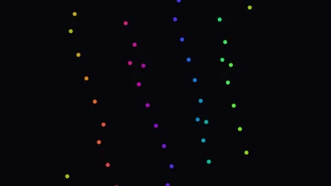 Colorful circles move in a vertical pattern on a dark Stock Footage 338195634