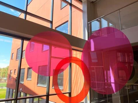 Colorful circular decor elements in a modern public building interior, featuring Stock Photos