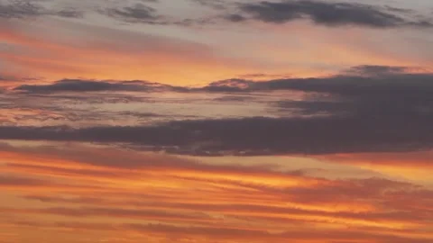 Colorful Cirrus Clouds Float across the Beautiful Evening Fiery Blue Orange Suns Video stock 264042250