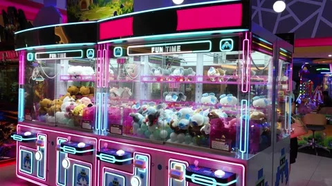 Colorful Claw Machine Inside Arcade With Plush Toys and Neon Lights Stock Footage 309840937