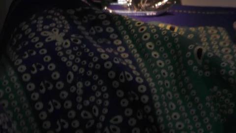A colorful cloth is on sewing machine for stitching Stock Footage 112855154