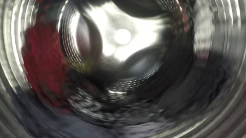 Colorful clothes being washed, rinse and spin inside of the drum of the washer Stock Footage 124352184