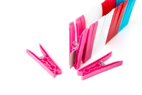 Colorful clothes  pegs made of plastic in  a row Stock Photos